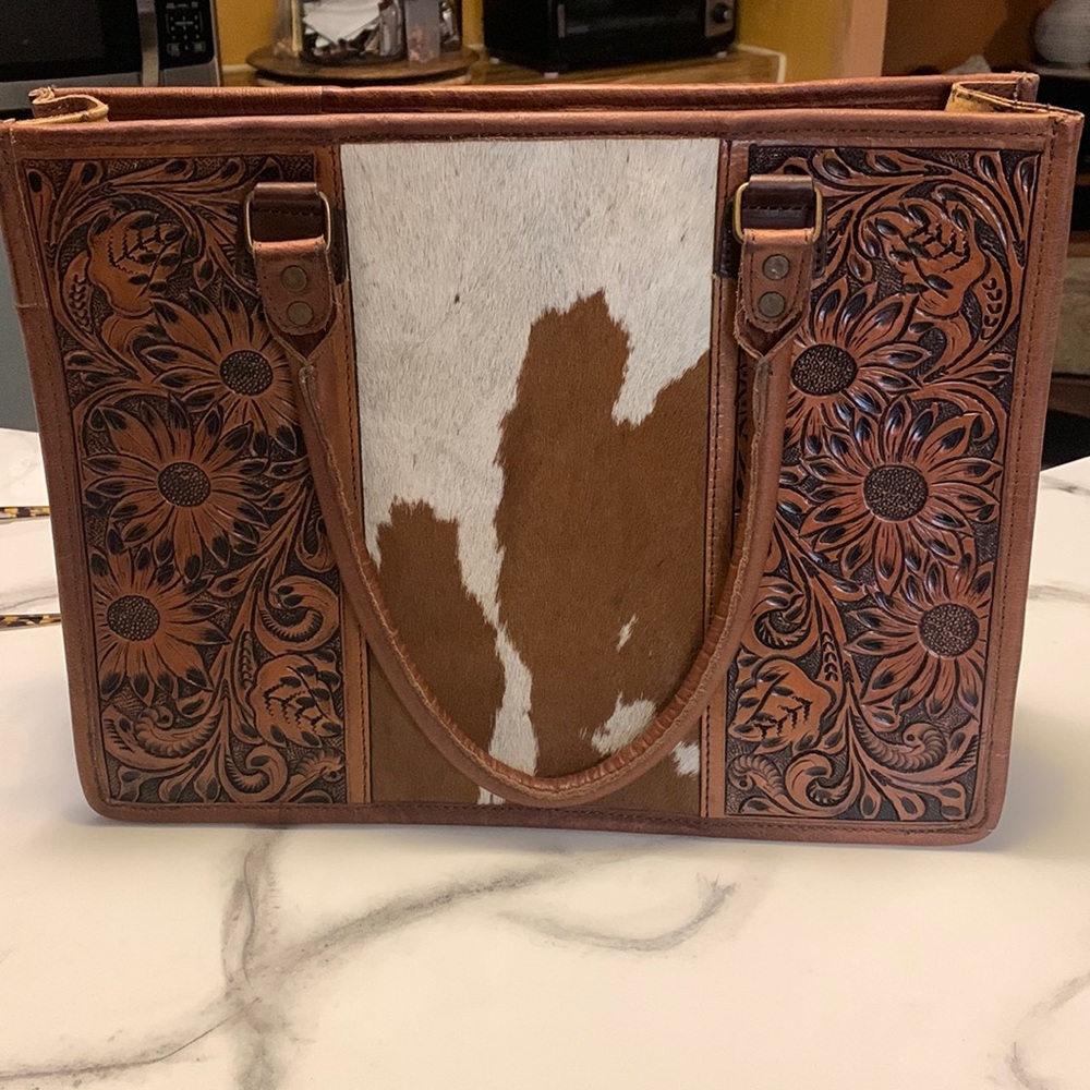 Women’s leather/animal hair purse. With tooled strap